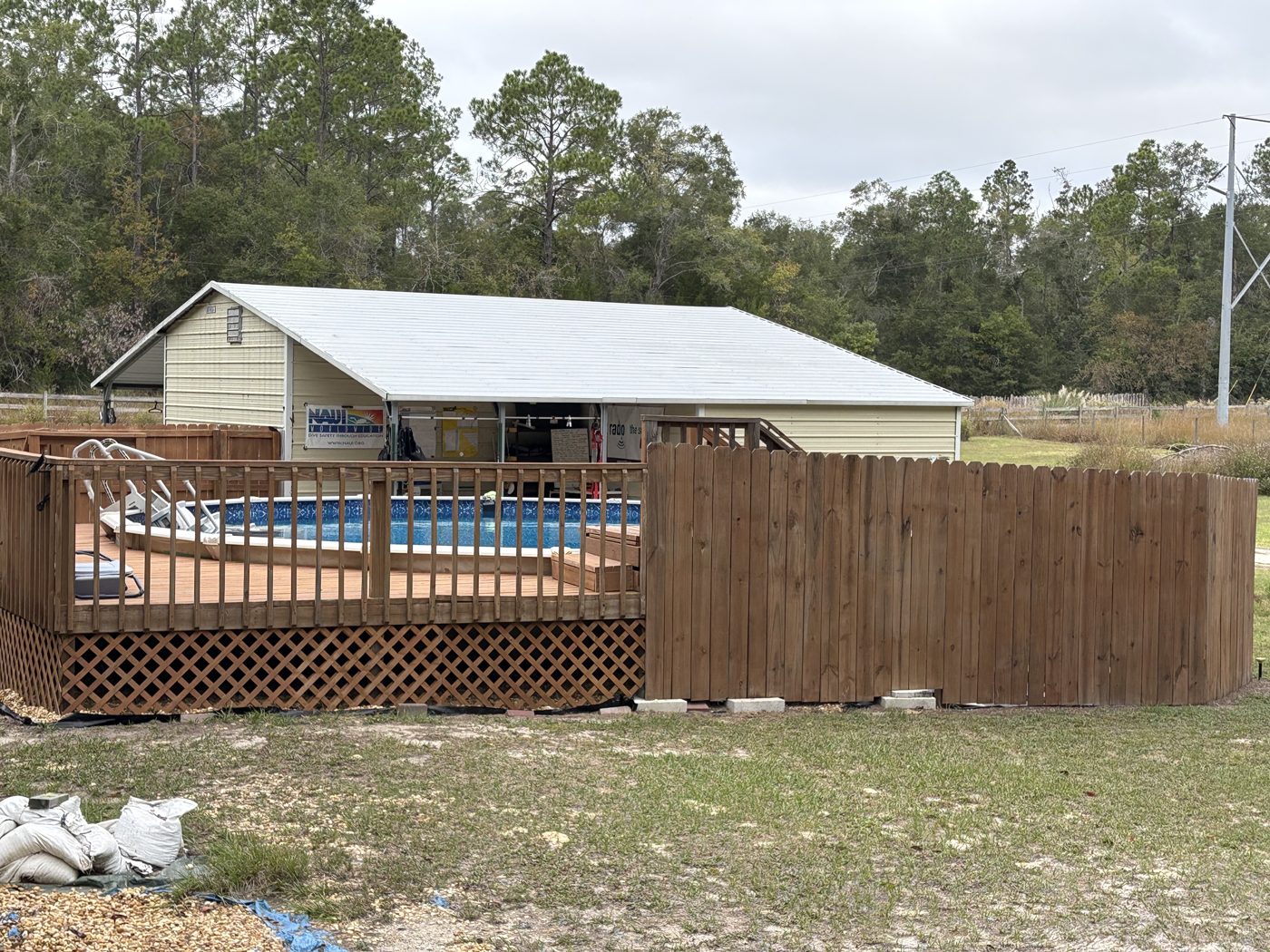The fenced training pool with its deck and covered classroom