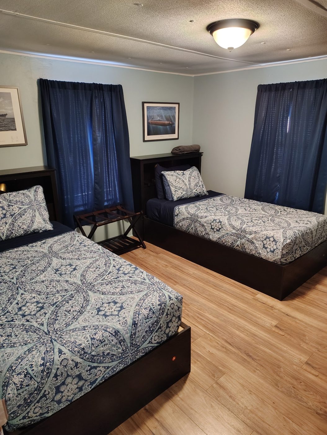 The Peacock Room: two twin beds with navy curtains